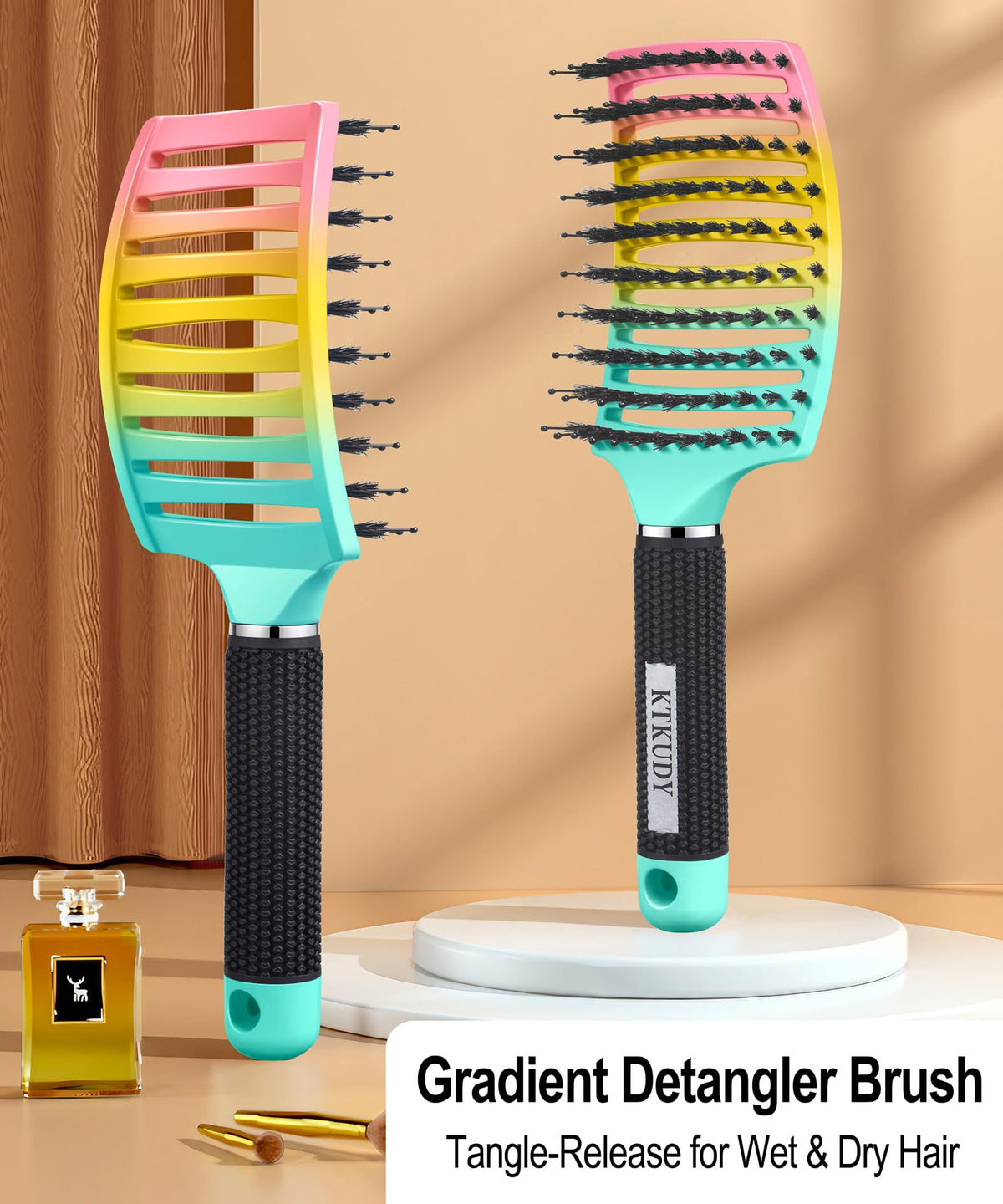 KTKUDY Detangling Brush showing ergonomic handle design