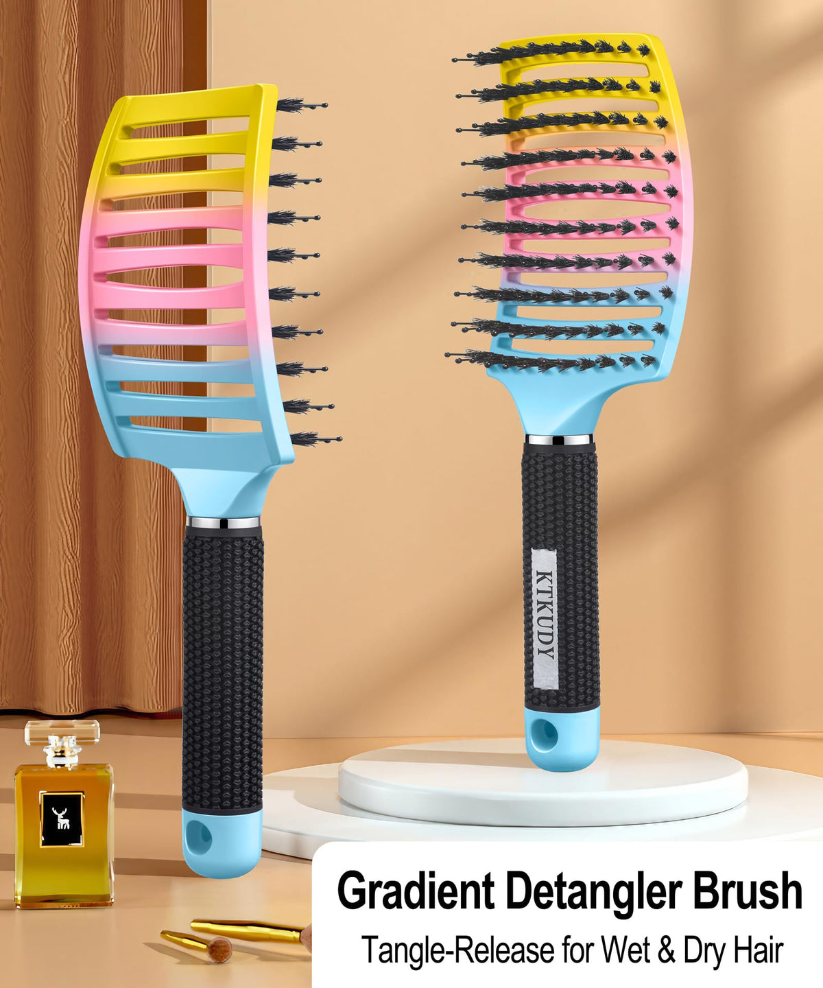 KTKUDY Detangling Brush showing ergonomic handle design
