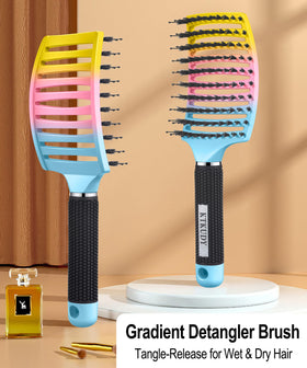 KTKUDY Detangling Brush showing ergonomic handle design