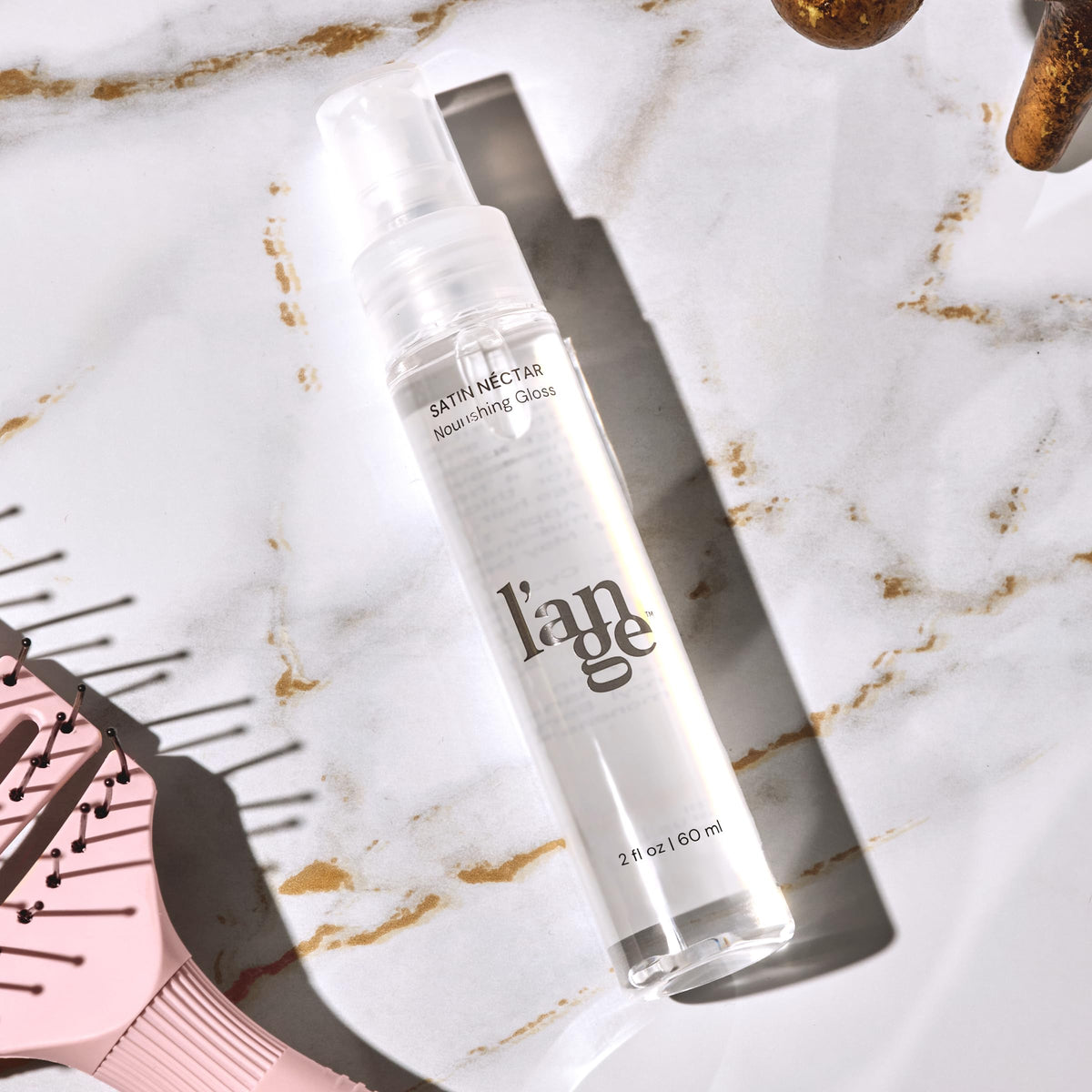 L'ANGE HAIR Satin Néctar Hair Serum on a bathroom counter