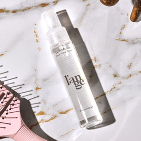 L'ANGE HAIR Satin Néctar Hair Serum on a bathroom counter