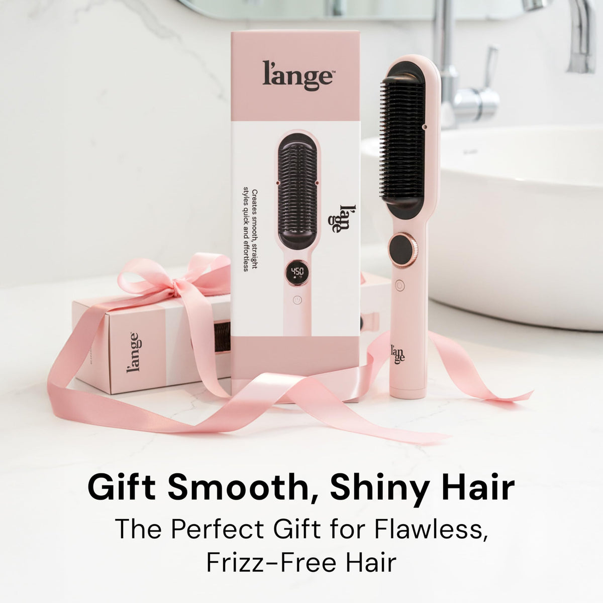 L'ANGE HAIR Smooth It 2-in-1 Hair Straightener Brush on a vanity table
