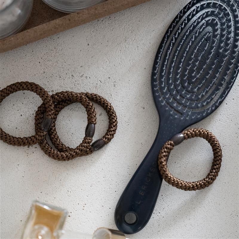 L. Erickson Black Hair Ties with Gold Bead on a model