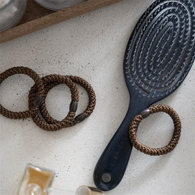 L. Erickson Black Hair Ties with Gold Bead on a model