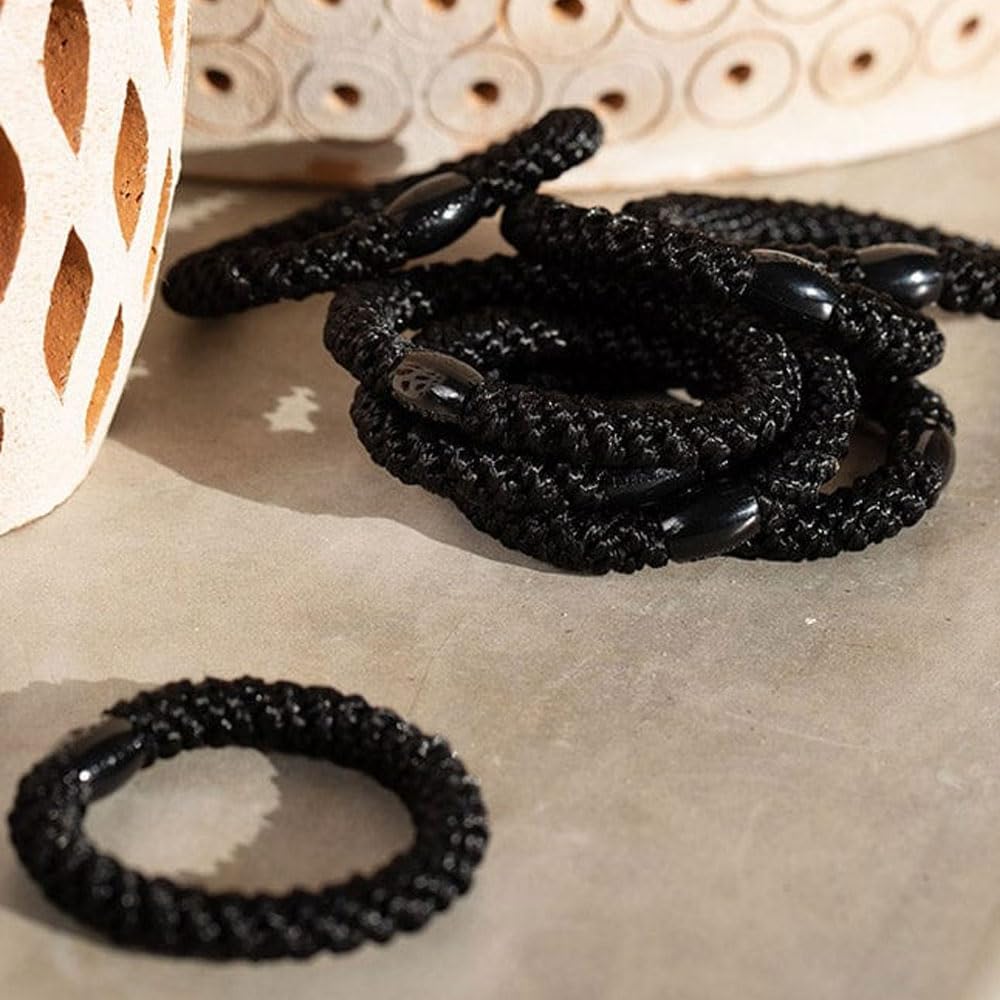 L. Erickson Grab & Go Ponytail Holders on a vanity