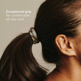 L. Erickson hair ties displayed on a flat surface
