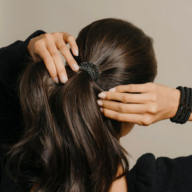 L. Erickson ponytail holder close-up showing braided design