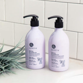L LUSETA Biotin B-Complex Shampoo and Conditioner set on a bathroom shelf
