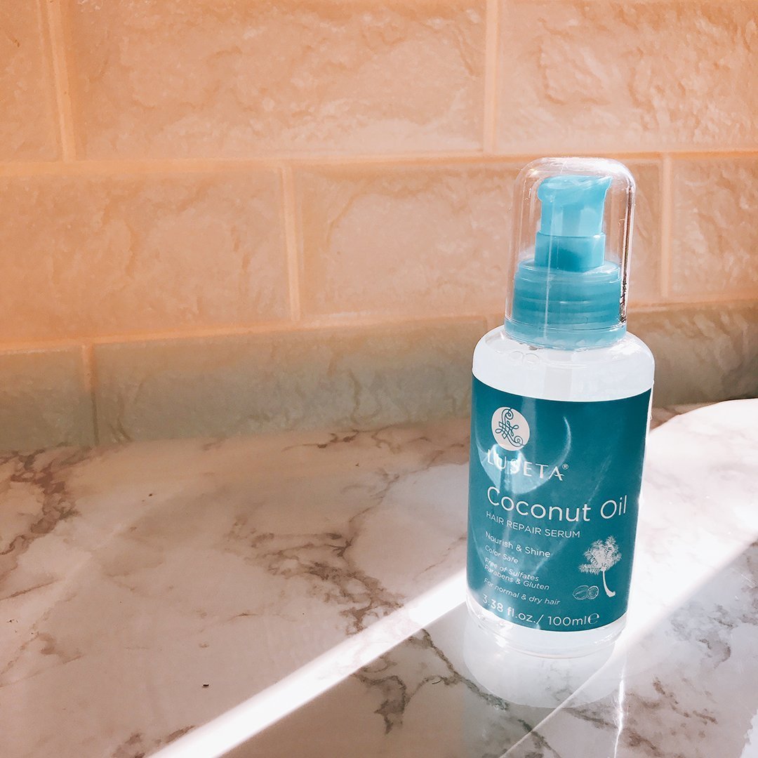 L LUSETA Coconut Milk Hair Repair Oil Serum on a wooden surface