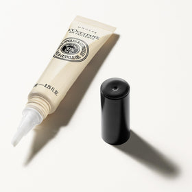 L'OCCITANE Nourishing Nail & Cuticle Oil on a wooden table