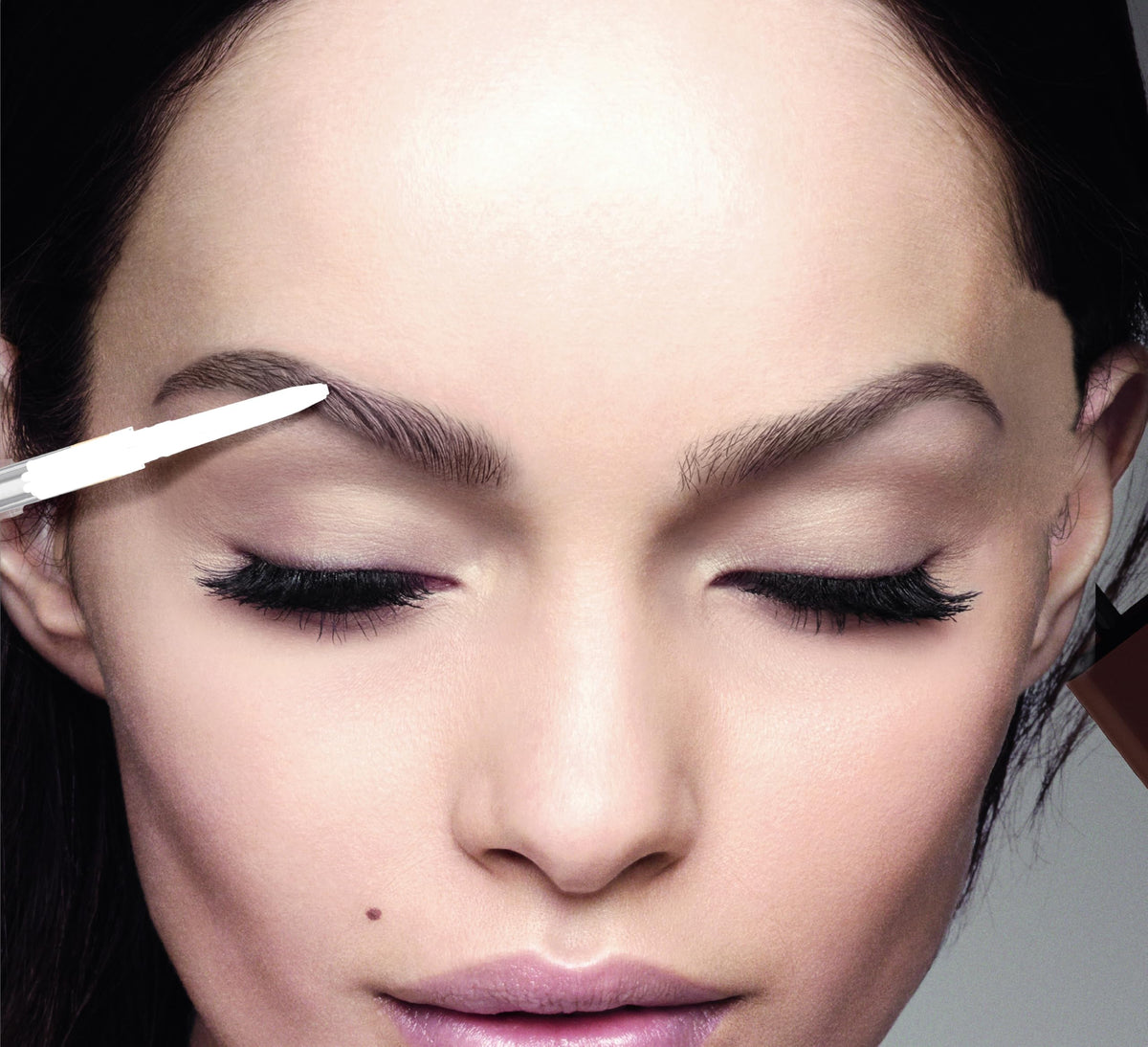 L'Oreal Paris Brow Stylist Definer pencil alongside other makeup products