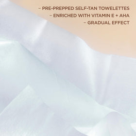 L'Oreal Paris Sublime Bronze Self-Tanning Towelettes in hand for application