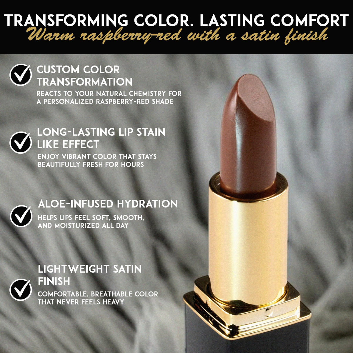 L'Paige lipstick in hand against a neutral background
