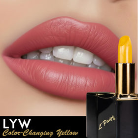 L'Paige lipstick in hand with coral pink shade