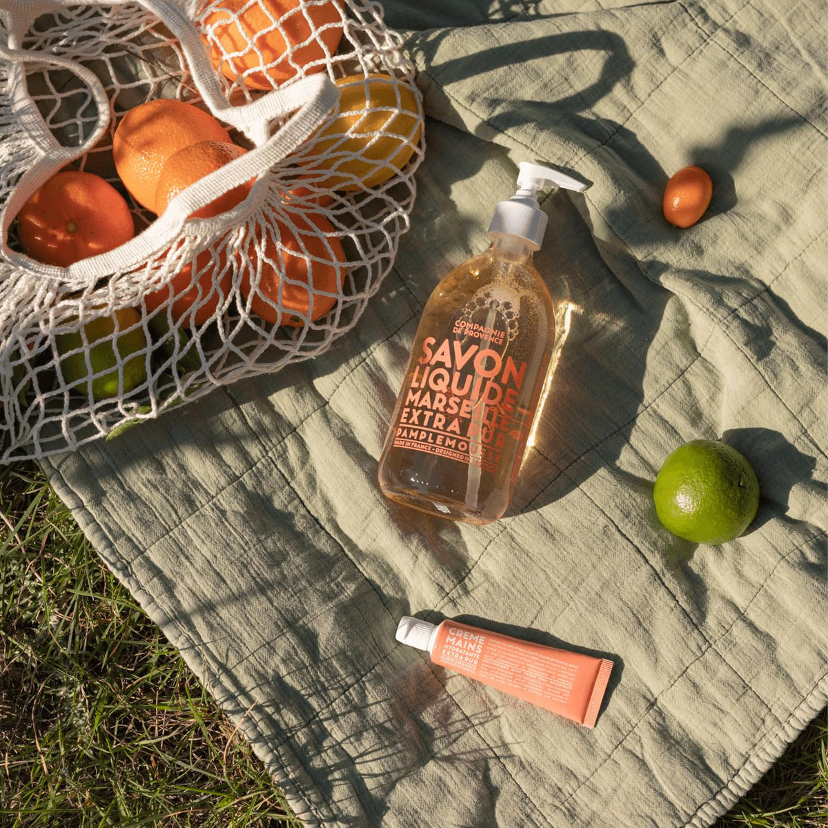 La Compagnie de Provence Luxe Liquid Soap Pink Grapefruit in bathroom setting