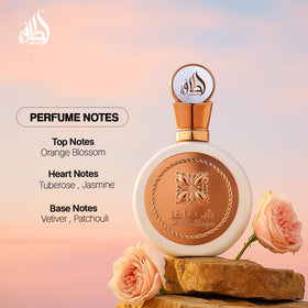 Lattafa Fakhar Eau de Parfum 100ml in a floral setting