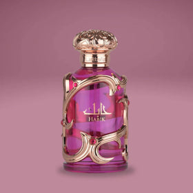 Lattafa Habik Eau de Parfum 100 ml with a soft-focus floral backdrop