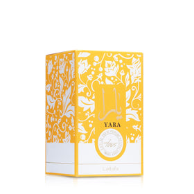 Lattafa Yara Tous Eau de Parfum bottle with tropical background