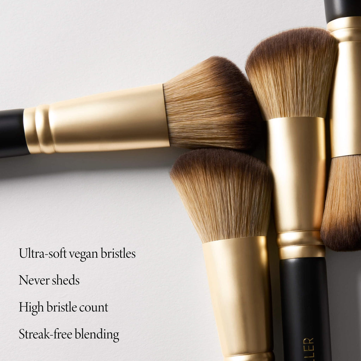 LAURA GELLER Angled Blush Brush in use applying blush on cheeks