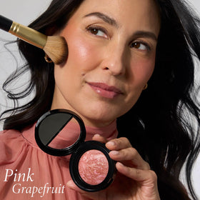 LAURA GELLER Baked Blush-n-Brighten Powder Blush close-up of texture
