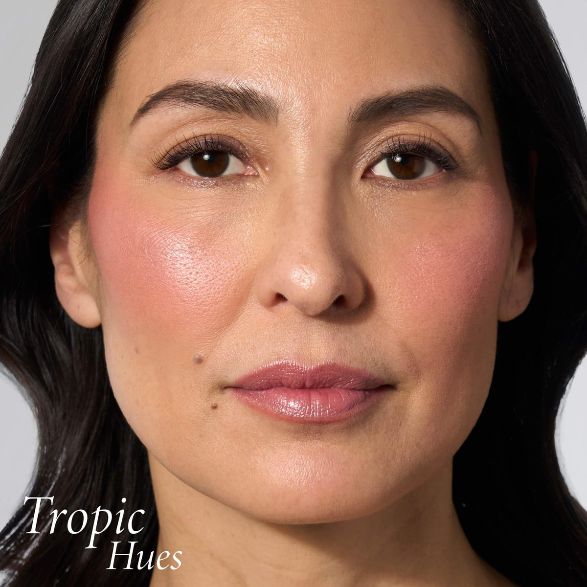 LAURA GELLER Baked Blush-n-Brighten Powder Blush Tropic Hues applied on model
