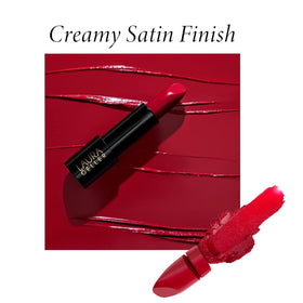 LAURA GELLER lipstick in hand with natural background