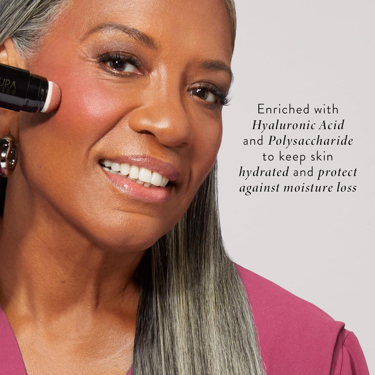 LAURA GELLER Serum Blush Tint on makeup table