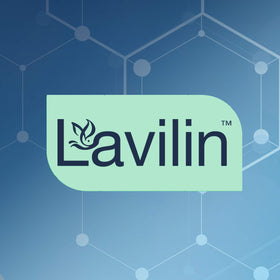 Lavilin Roll-On Deodorant on a countertop with fresh flowers