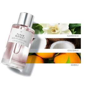 Le Monde Gourmand Fleur Monoi Hair & Body Mist 100ml with floral background