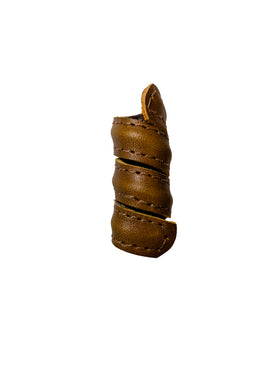 Leather hair bead close-up showing texture and colour