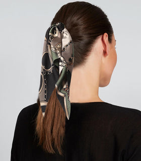LFOUVRE hair scrunchie in different styles on a flat surface