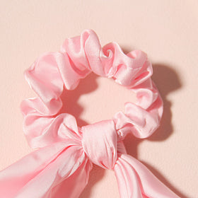 LFOUVRE hair scrunchie styled as a bracelet