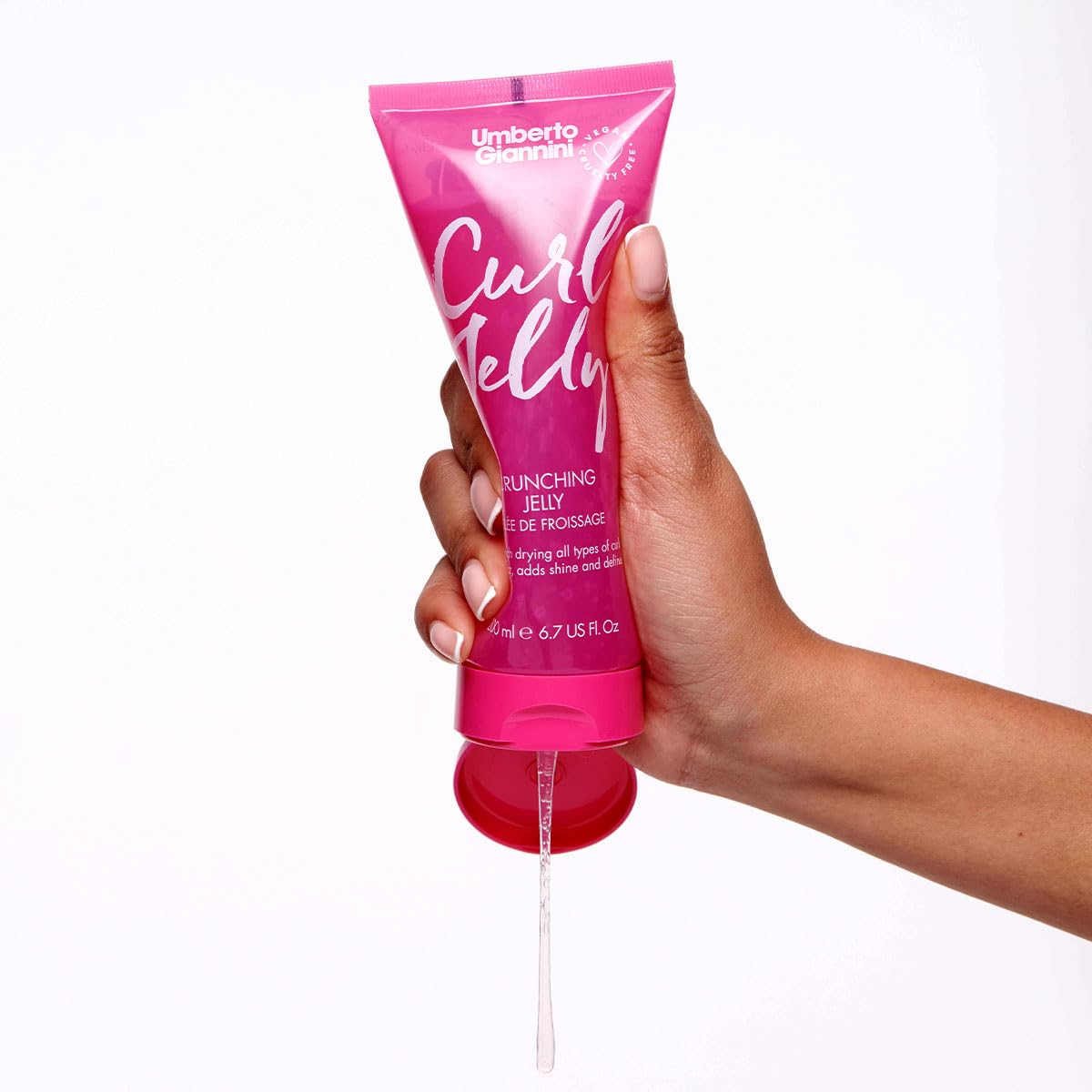 Lifestyle image of a woman applying hair cream