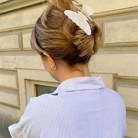 Lifestyle image of ACO-UINT Hair Claw Clips styled with casual outfit