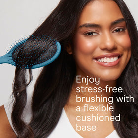 Lifestyle image of Conair hair brush set in use on wet hair