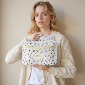 Lifestyle image of HBselect Quilted Makeup Bag in a travel setting