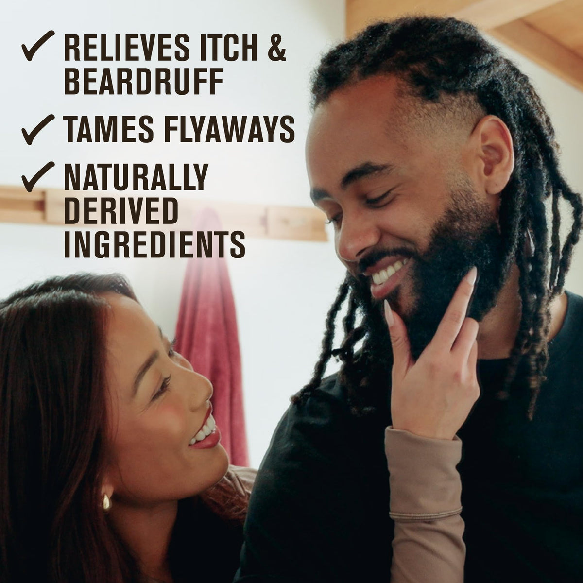 Lifestyle image of man applying beard oil