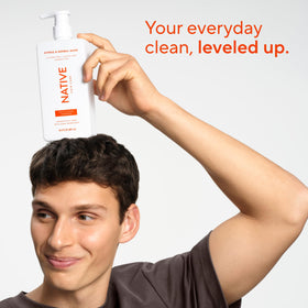 Lifestyle image of Native Shampoo and Conditioner in a bathroom setting