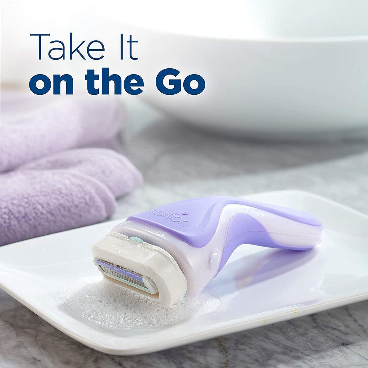 Lifestyle image of Schick Intuition Pure Nourishment razor in a bathroom setting