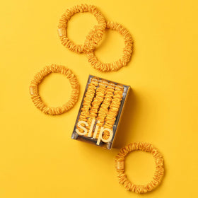 Lifestyle image of SLIP scrunchies in a hair styling setting