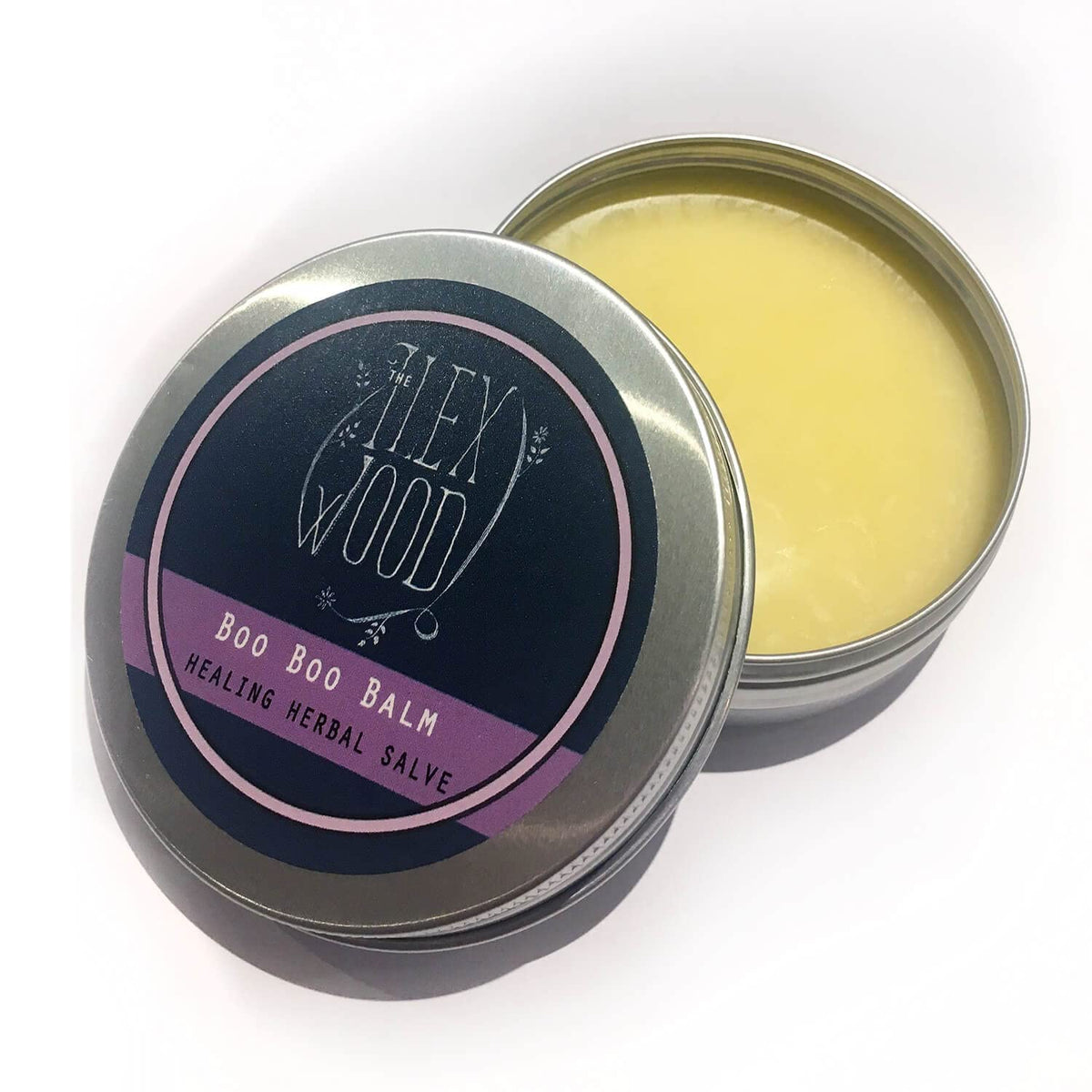 Lifestyle image of The Ilex Wood salves in use on hands