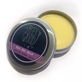 Lifestyle image of The Ilex Wood salves in use on hands