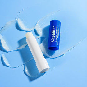 Lifestyle image of Vaseline Lip Therapy in a bag