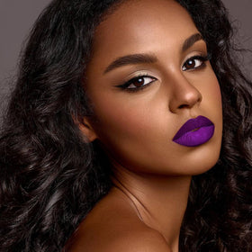 Lifestyle image of woman applying Depuplum Matte Liquid Lipstick
