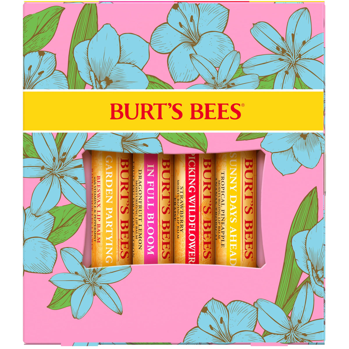 Lifestyle scene of Burt's Bees lip balm set on a wooden table