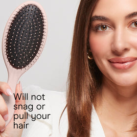 Lifestyle scene of Conair Detangling Hair Brush in use