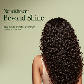 Lifestyle scene with Dabur Amla Hair Oil on a vanity