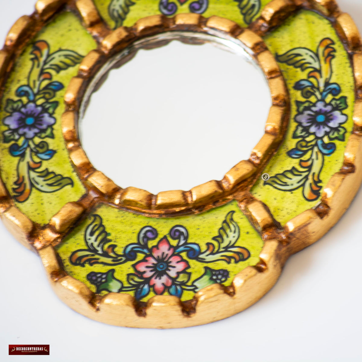 Lifestyle scene with DecorContreras Small Oval Wall Mirror and decorative elements
