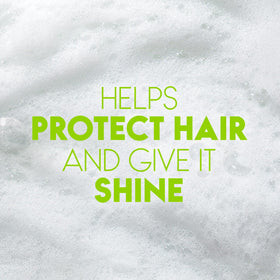 Lifestyle scene with Head & Shoulders Green Apple Shampoo in a bathroom