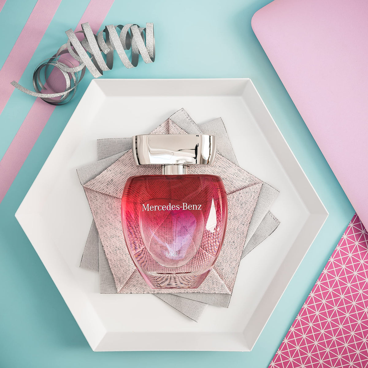 Lifestyle scene with Mercedes Benz Rose Eau De Toilette on a vanity